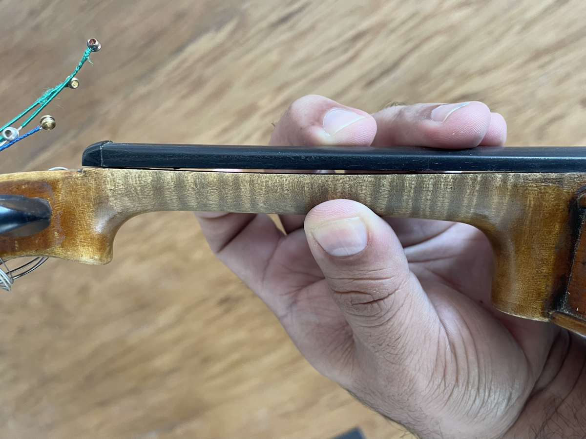 Fingerboard re-glue repair process at Bosky Strings