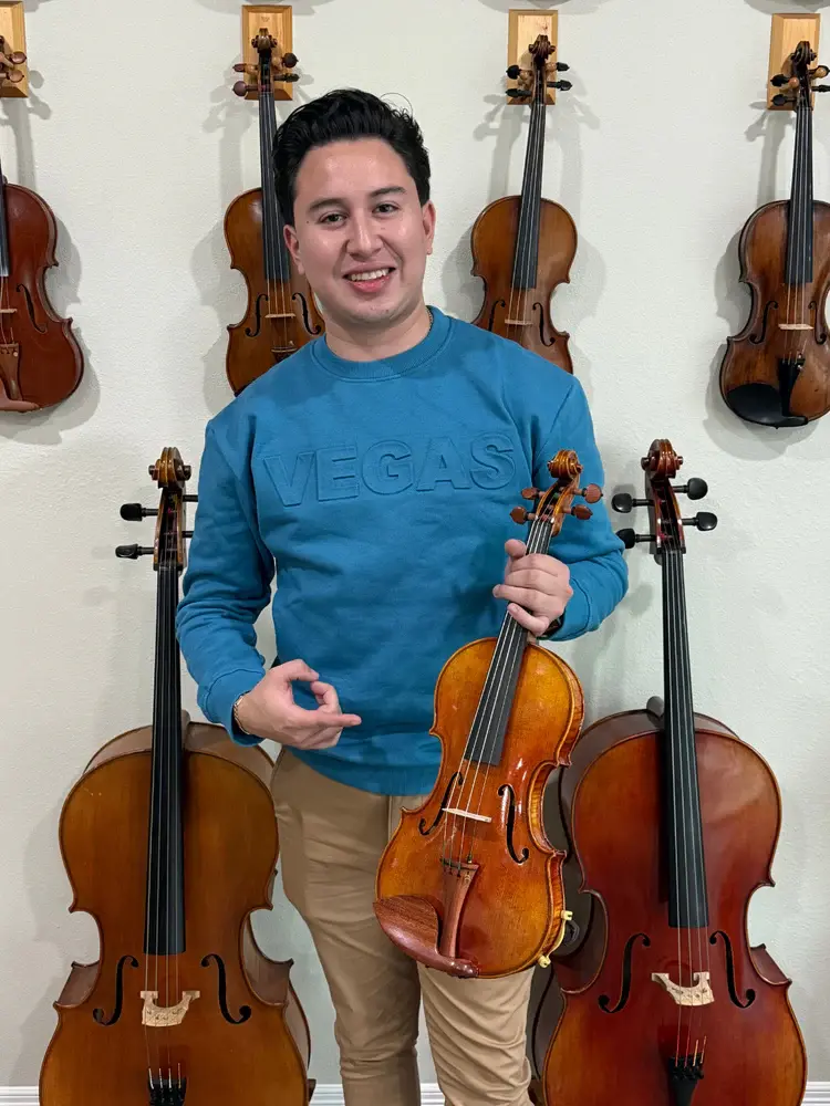 Nathan Fernandez, violinist for Mariachi Sol De Mexico de Jose Hernandez, with a violin from Bosky Strings in Edinburg, Texas